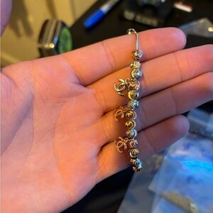 Adjustable tri color Chanel bracelet with Chanel logo and moon cut balls